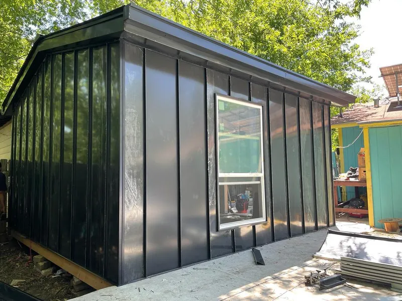 Black standing seam metal wall panels for Roof Inspection in Brushy Creek