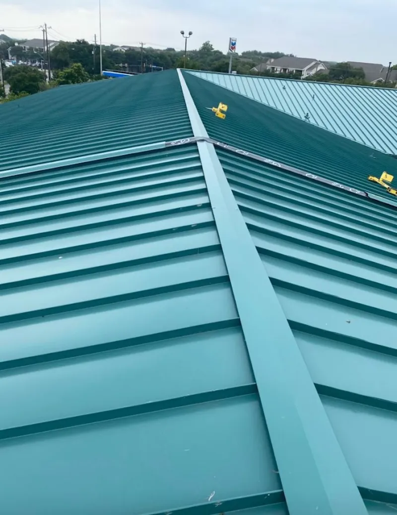 Green commercial metal roof ridge and valley for Metal Roof Repair in Brushy Creek