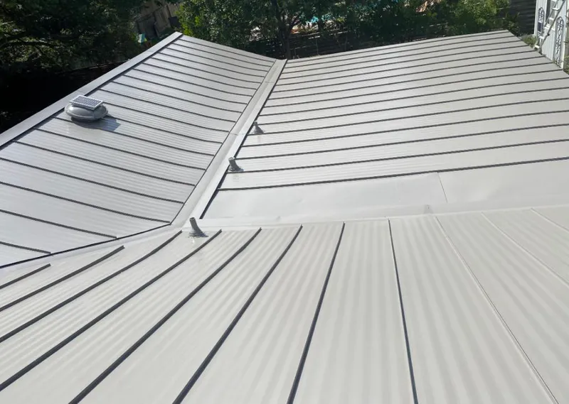 Solar attic fan installed on a metal roof for Roof Ventilation in Brushy Creek